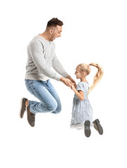 Man and his little daughter jumping against white background