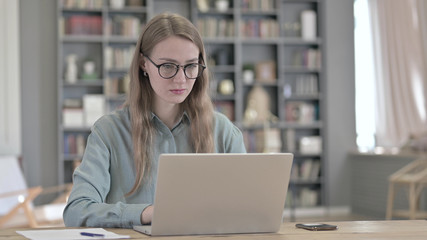 The Portrait of Serious Woman Working on Laptop