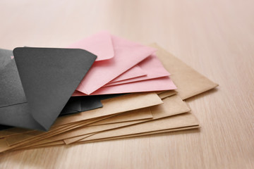 Many paper envelopes on table