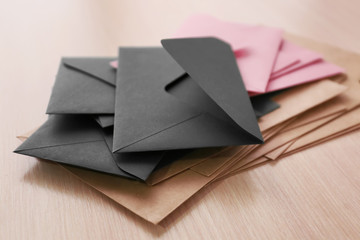 Many paper envelopes on table