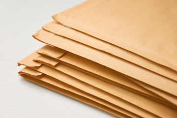 Many envelopes parcels on table, closeup