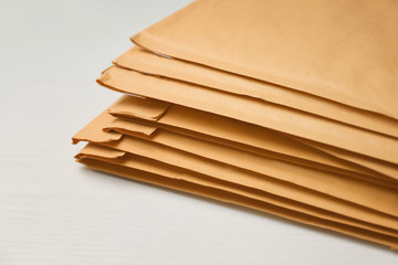 Many envelopes parcels on table, closeup