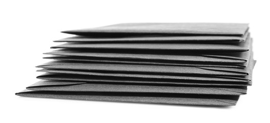 Stack of paper envelopes on white background