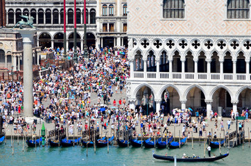 Summer tourists crown St Mark's Plaza  in Venice, Italy