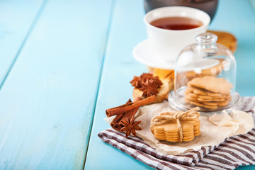 cookies with cinnamon and tea on a table, selective focus, copy space
