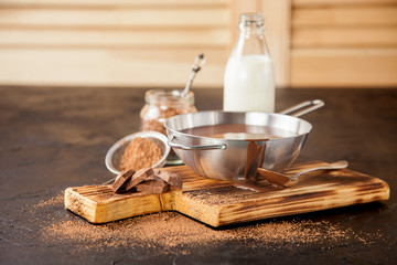 hot chocolate in a pan on a board, selective focus, copy space