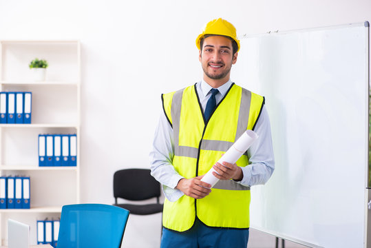 Young male architect in presentation concept