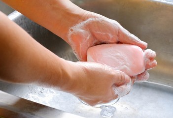 Fototapeta premium Washing hands with soap for protect infection from Covid-19, other viruses and becteria.