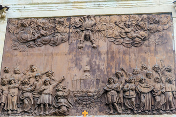 Bas-relief "Overthrow of Simon Magi by Apostle Peter" on Peter gate in Peter and Paul fortress in Saint Petersburg, Russia