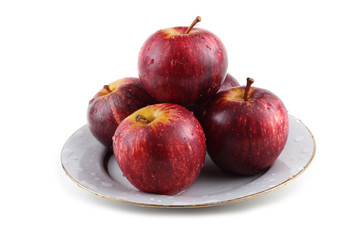 Gala apples on dish