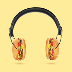Tasty and juicy hamburger concept. Headphones with burgers.