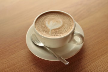cup of coffee on wooden table