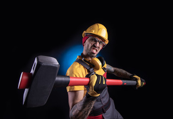 the male construction worker with a sledgehammer