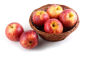 Gala apples on wicker plate