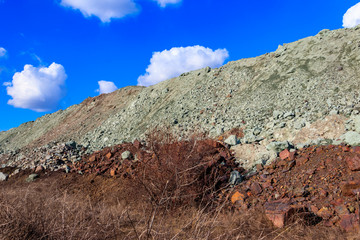 View of slag heaps of iron ore quarry. Mining industry