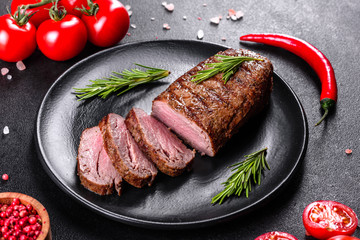 Ribeye steak with potatoes, onions and cherry tomatoes