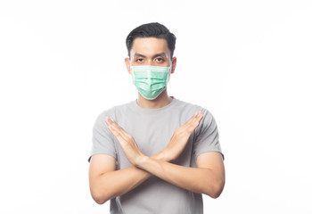 Young Asian Man wearing hygienic mask gesturing stop to prevent infection, 2019-nCoV or coronavirus. Airborne respiratory illness such as pm 2.5 fighting and flu. isolated on white background.