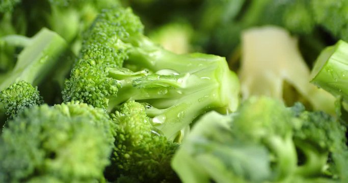 Rotating fresh broccoli close up .