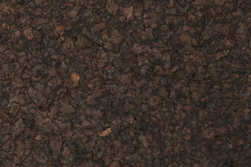 Texture of dark cork with oil finish