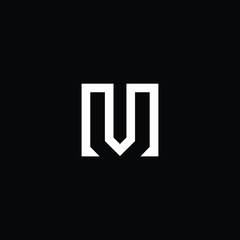 Fototapeta premium Minimal elegant monogram art logo. Outstanding professional trendy awesome artistic M MV VM initial based Alphabet icon logo. Premium Business logo White color on black background