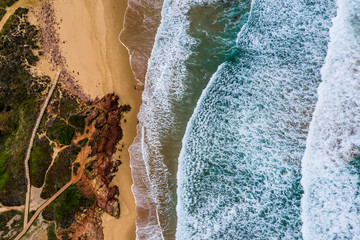 Algarve, Portugal. Waves, Rocks, Beach. Background. Aerial from above