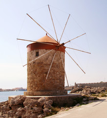 Fototapeta na wymiar Windmills in Mandraki harbour, Rhodes, Greece