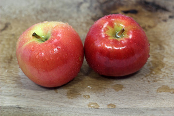Two wet apples on board