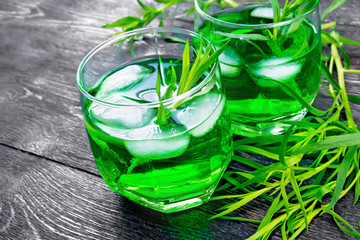 Lemonade Tarragon in two glasses on dark board