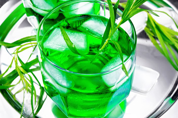 Lemonade Tarragon with ice in two glasses on tray