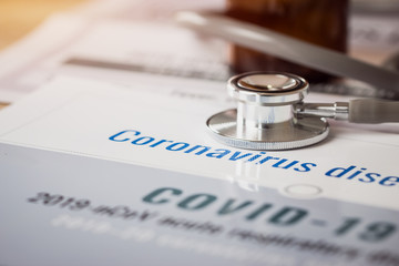 Stethoscope on text covid-19, Coronavirus 2019-nCov novel coronavirus concept : Influenza as dangerous flu strain cases pandemic disease, Virus Pandemic Protection, impact in life work economy world