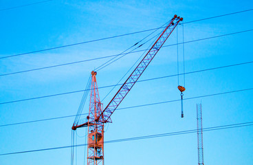 crane against the sky and power lines photo background for pattern, graphic design, print jobs and...