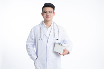 A young Asian doctor is using a device