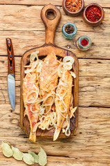 Fried fish with horseradish roots