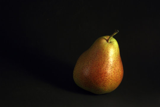 Pear on black background