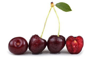 Cherries with leaf and cherry halves