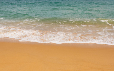 Fototapeta na wymiar wave on a sandy beach