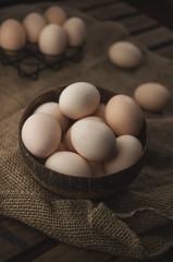 Natural, organic eggs in wooden bowl, zero waste Easter
