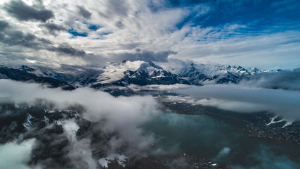 Fototapeta na wymiar aerial shot of lake zell with alps mountains on the background, zell-am-see