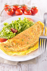 omelet and salad in plate
