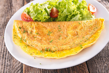 omelet and salad in plate