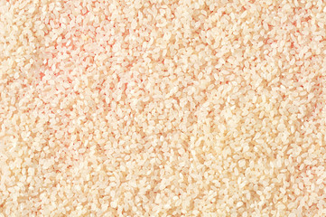 Scattered grain of white rice. Background. Top view