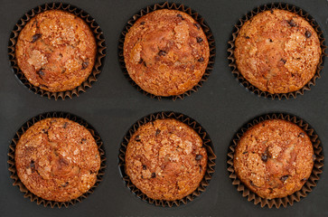 Homemade banana muffins with chocolate chips and salted caramel. Delicious and healthy dessert for Breakfast. Selective focus, top view