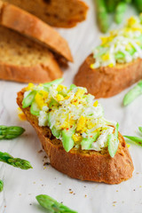 Rye bread sandwich with asparagus, feta cheese and egg. Delicious and healthy Breakfast. Bruschetta. Rustic style. Selective focus
