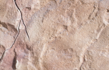 Beautiful texture of beige stone with veins