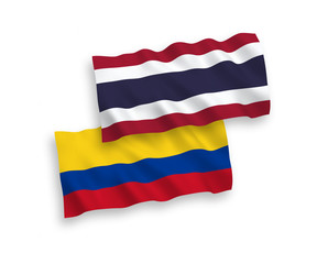 Flags of Colombia and Thailand on a white background
