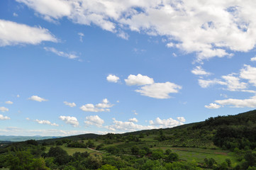 Fototapeta na wymiar Beautiful dynamic sky above green hill. Natural background