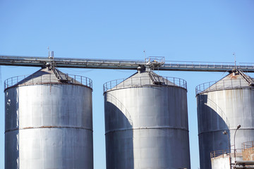 Metal Silo in beautiful landscape with blue sky