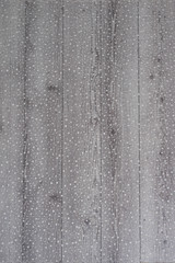 White wooden background with white spring flowers roses and lace ribbon. Happy womans day. The texture of lace on wooden background.