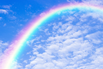 A beautiful rainbow in blue sky background.