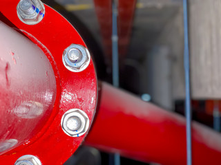 Blurred Fire pump system with big red pipe line system background
